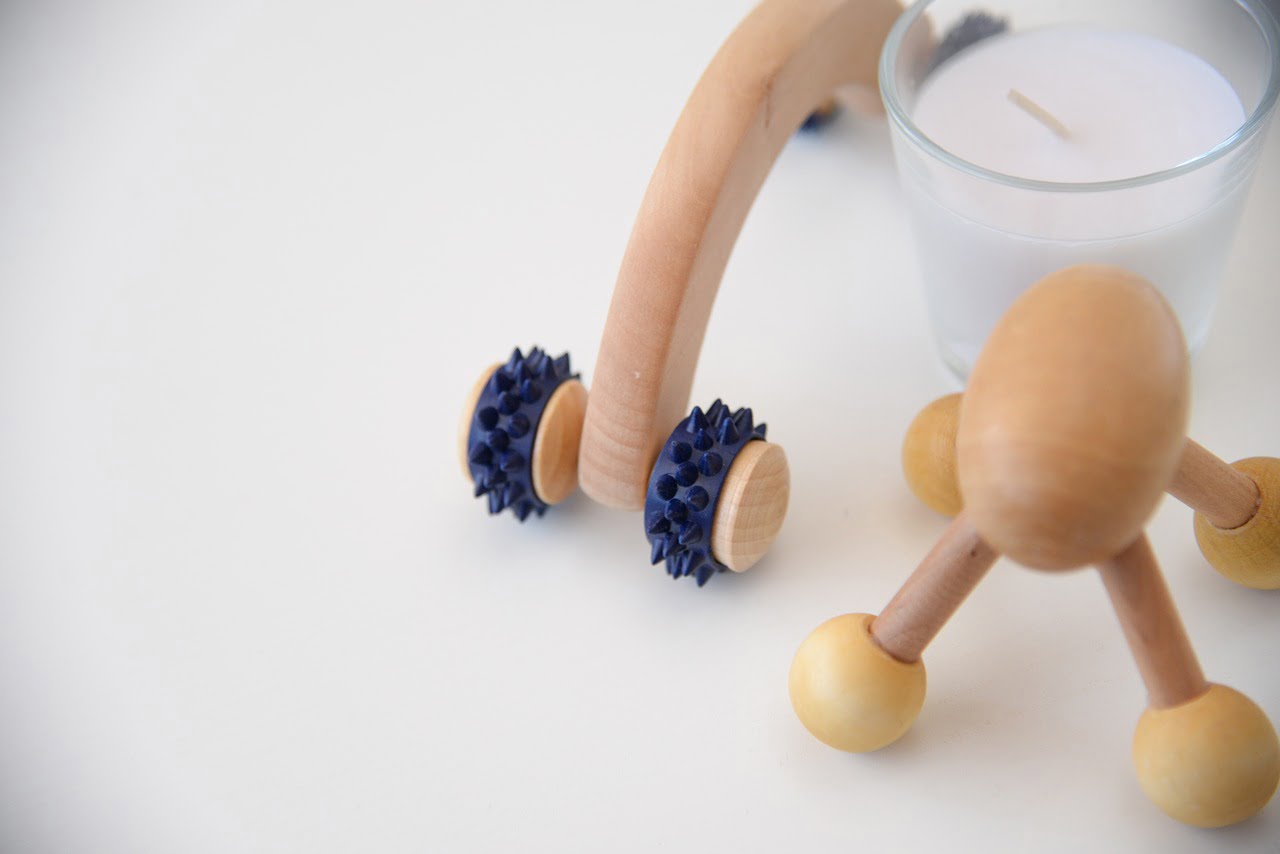 a person's hand holding a pill bottle